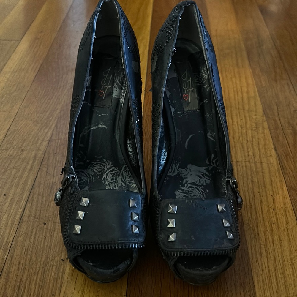 Black iron fist peep toe pumps with black rhinestone skulls and skull accept zip